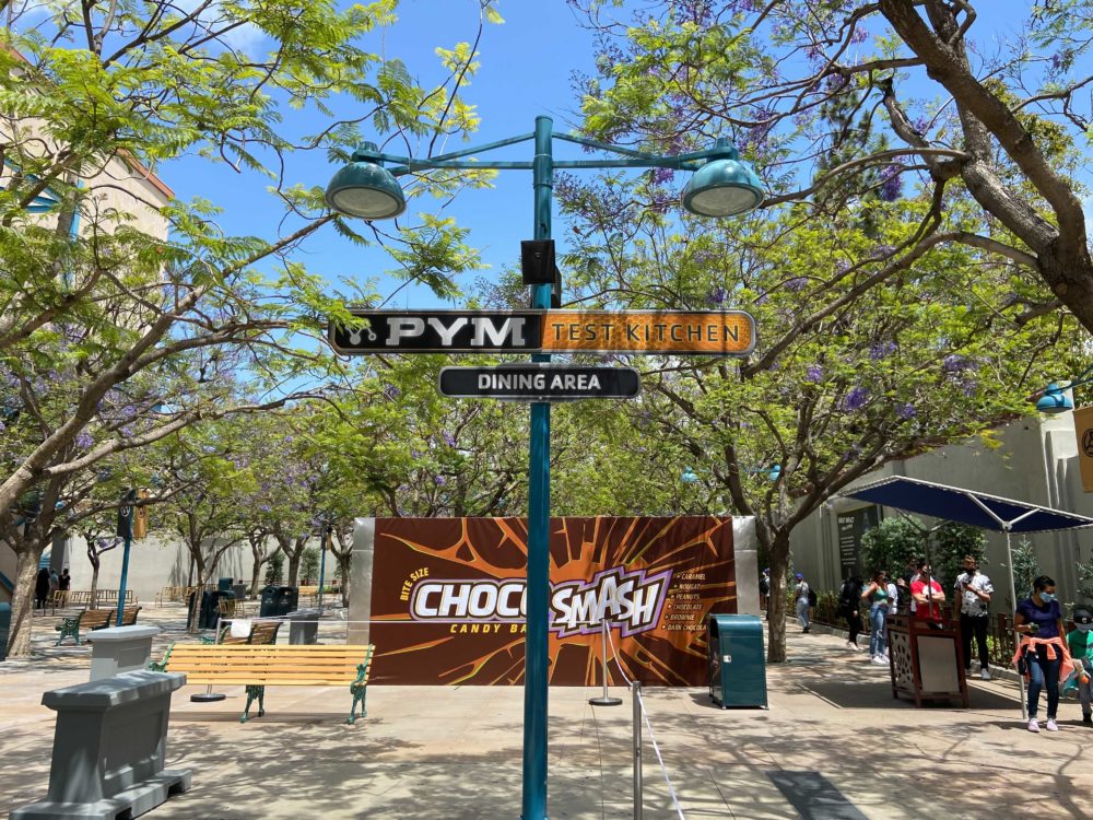 PHOTOS Pym Test Kitchen Dining Area Sign And Giant Choco Smash Bar   Pym Test Kitchen Dining Area Avengers Campus Disney California Adventure 5 20 21 11 5965359 1000x750 1 