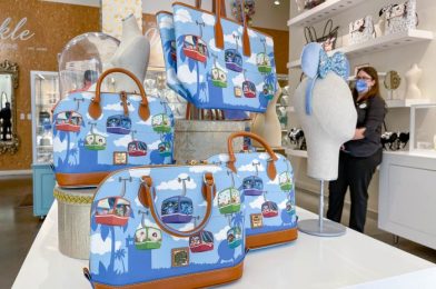 First Look at the New “it’s a small world” Dooney and Bourke Collection in Disney World