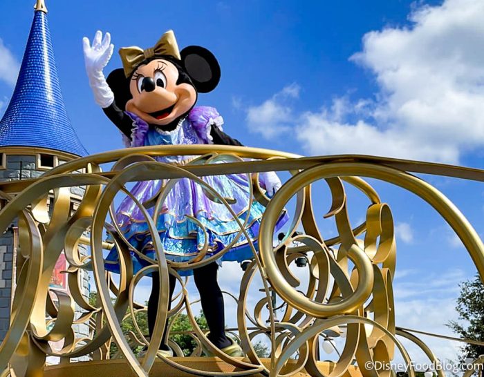 https://www.disneybymark.com/wp-content/uploads/2021/11/2021-wdw-disney-world-atmos-magic-kingdom-50th-anniversary-celebration-cavalcade-minnie-mouse-stock-50th-character-outfits-700x546-2.jpg